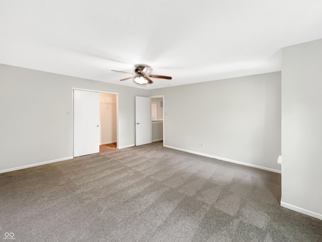2116 Orchid Bloom Dr, Indianapolis, IN 46231 - unfurnished bedroom with carpet floors, baseboards, ceiling fan, and a closet