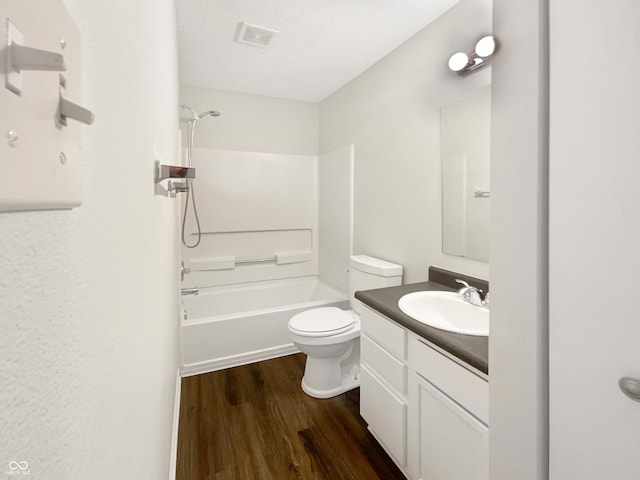 2116 Orchid Bloom Dr, Indianapolis, IN 46231 - bathroom with wood finished floors, vanity, toilet, and washtub / shower combination
