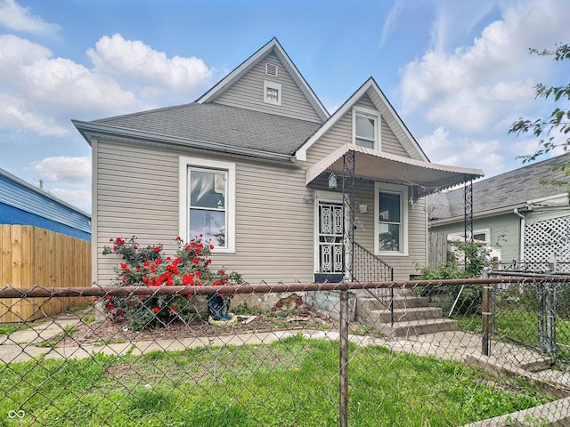 2006 N Olney St, Indianapolis, IN 46218 - view of front of house featuring roof with shingles