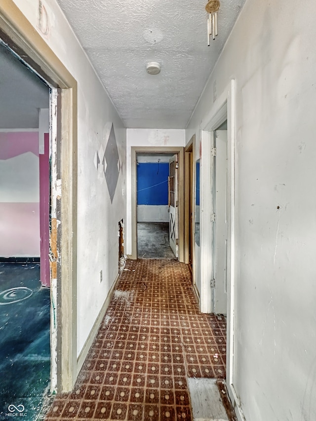 2006 N Olney St, Indianapolis, IN 46218 - corridor featuring tile patterned floors and a textured ceiling