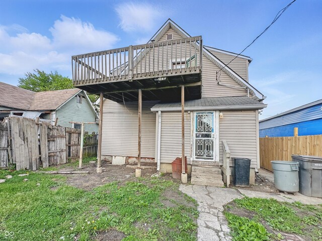 2006 N Olney St, Indianapolis, IN 46218 - rear view of house featuring fence and a deck