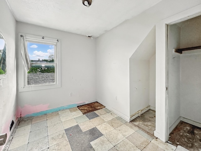 2006 N Olney St, Indianapolis, IN 46218 - unfurnished bedroom featuring a closet and baseboards