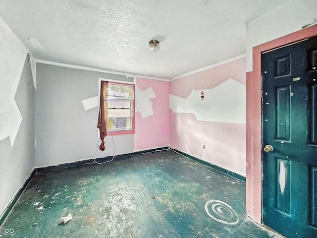 2006 N Olney St, Indianapolis, IN 46218 - spare room with a textured ceiling, cooling unit, baseboards, and crown molding