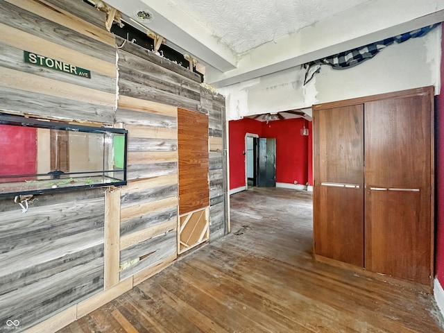 2006 N Olney St, Indianapolis, IN 46218 - corridor featuring hardwood / wood-style flooring and wooden walls