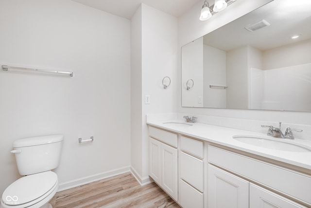 18967 Seaforth Way, Westfield, IN 46074 - bathroom with wood finished floors, toilet, baseboards, and double vanity