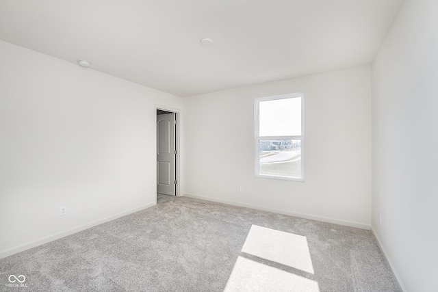 18967 Seaforth Way, Westfield, IN 46074 - spare room with light carpet, baseboards, and a smoke detector