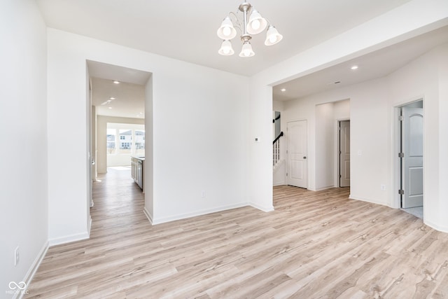 18967 Seaforth Way, Westfield, IN 46074 - empty room featuring light wood-type flooring, a chandelier, recessed lighting, baseboards, and stairs