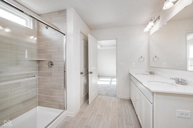 18967 Seaforth Way, Westfield, IN 46074 - bathroom with a tile shower, double vanity, and baseboards