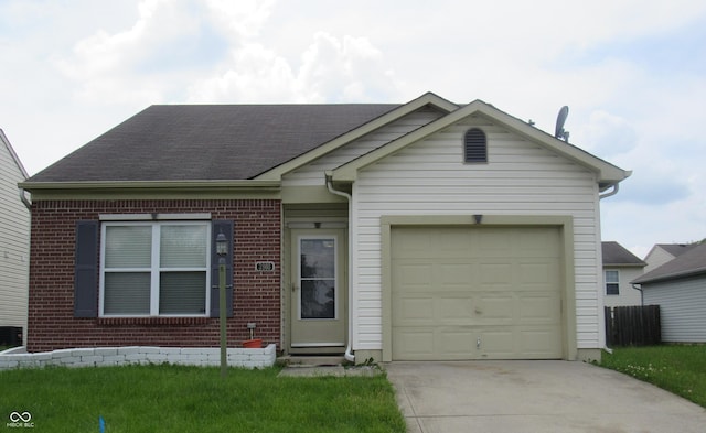3908 Roundwood Dr, Indianapolis, IN 46235 - view of front of property with brick siding, driveway, an attached garage, and roof with shingles