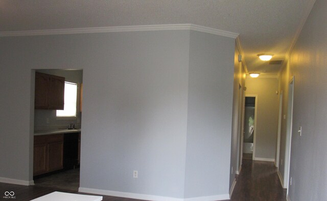 3908 Roundwood Dr, Indianapolis, IN 46235 - hall featuring dark wood-style floors, crown molding, and baseboards
