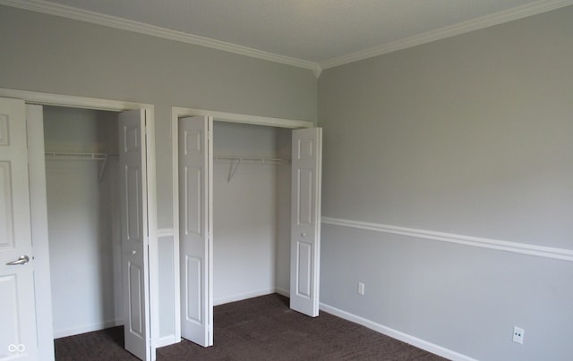 3908 Roundwood Dr, Indianapolis, IN 46235 - unfurnished bedroom with multiple closets, dark carpet, ornamental molding, and baseboards