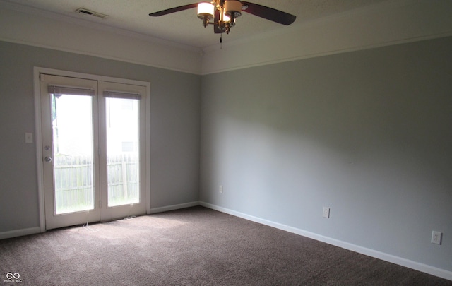 3908 Roundwood Dr, Indianapolis, IN 46235 - empty room with carpet flooring, a ceiling fan, plenty of natural light, baseboards, and crown molding
