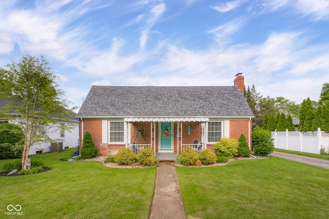 2021 Chestnut St, Columbus, IN 47201 - view of front of home with brick siding, a chimney, and roof with shingles
