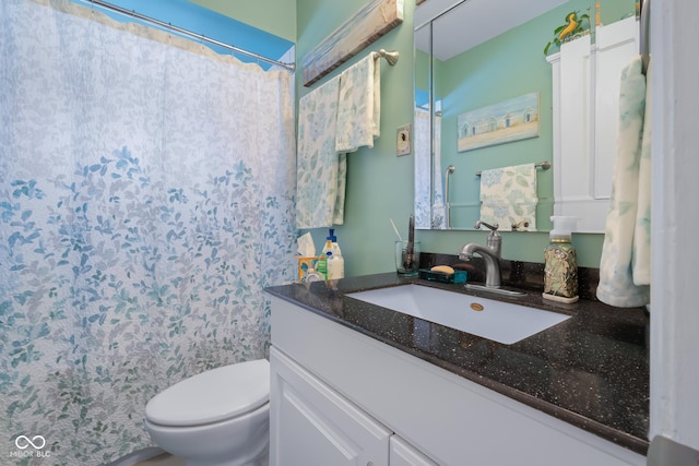 2021 Chestnut St, Columbus, IN 47201 - bathroom featuring toilet, vanity, and curtained shower