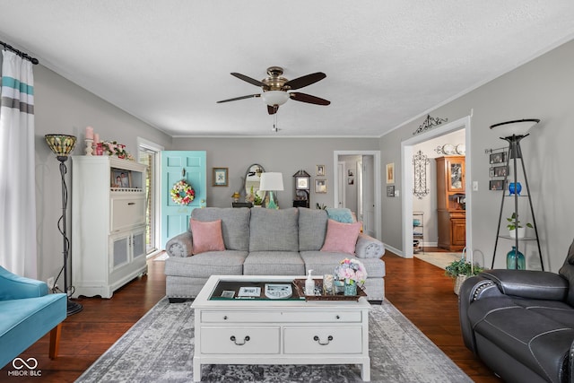 2021 Chestnut St, Columbus, IN 47201 - living area featuring ceiling fan, dark wood-style flooring, baseboards, and a textured ceiling