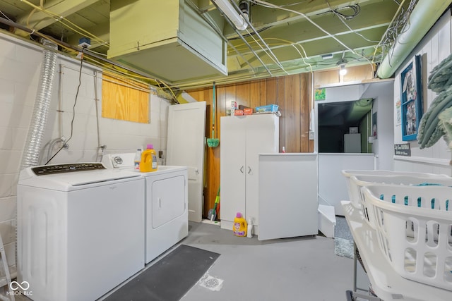 2021 Chestnut St, Columbus, IN 47201 - unfinished below grade area with separate washer and dryer and concrete block wall