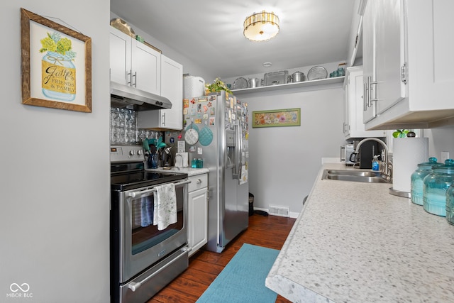 2021 Chestnut St, Columbus, IN 47201 - kitchen with stainless steel appliances, under cabinet range hood, a sink, light countertops, and white cabinetry