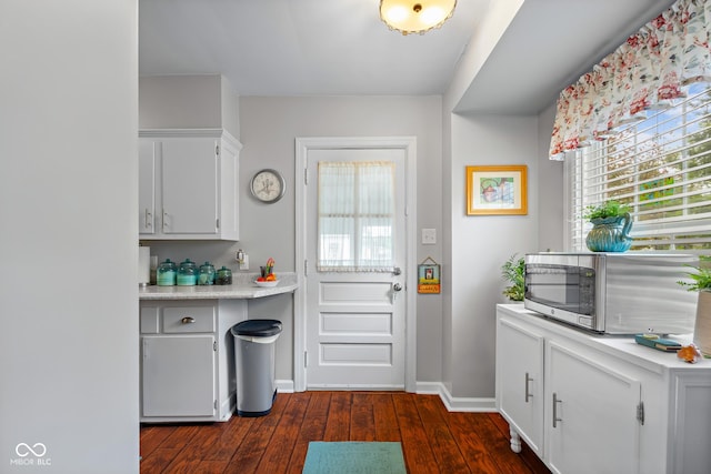 2021 Chestnut St, Columbus, IN 47201 - doorway with dark wood-style flooring and baseboards