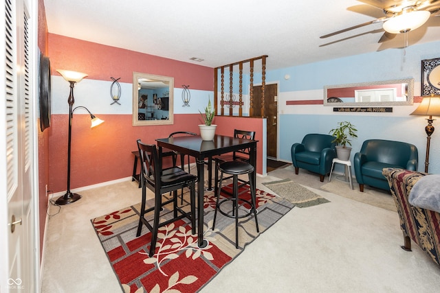 1602 Queensbridge Sq Unit 7, Indianapolis, IN 46219 - dining space featuring carpet flooring, ceiling fan, and baseboards