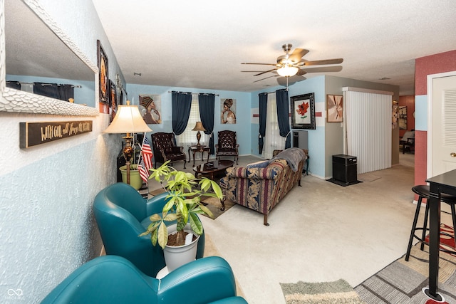 1602 Queensbridge Sq Unit 7, Indianapolis, IN 46219 - carpeted living room featuring ceiling fan and a textured ceiling