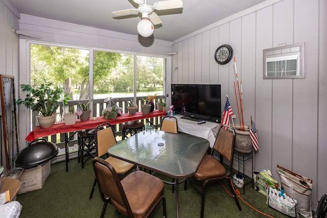 1602 Queensbridge Sq Unit 7, Indianapolis, IN 46219 - carpeted dining area featuring ceiling fan, healthy amount of natural light, and wooden walls