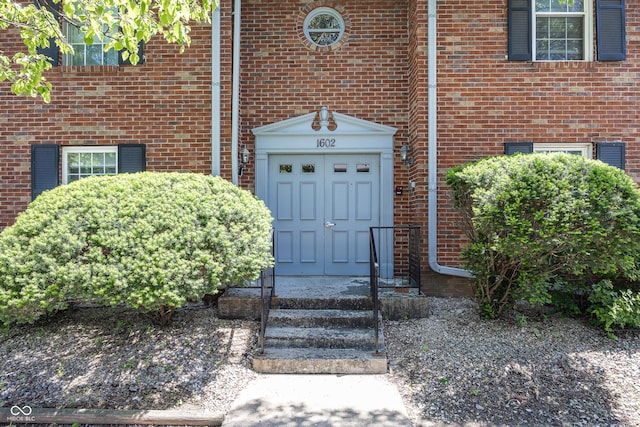 1602 Queensbridge Sq Unit 7, Indianapolis, IN 46219 - property entrance featuring brick siding