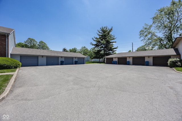 1602 Queensbridge Sq Unit 7, Indianapolis, IN 46219 - view of side of home with community garages