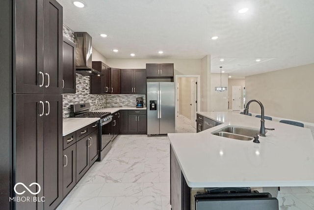 2502 Chrystal Woods Dr, Kokomo, IN 46901 - kitchen with appliances with stainless steel finishes, a sink, light marble finish floors, wall chimney range hood, and light countertops