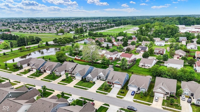 aerial perspective of suburban area with a nearby body of water