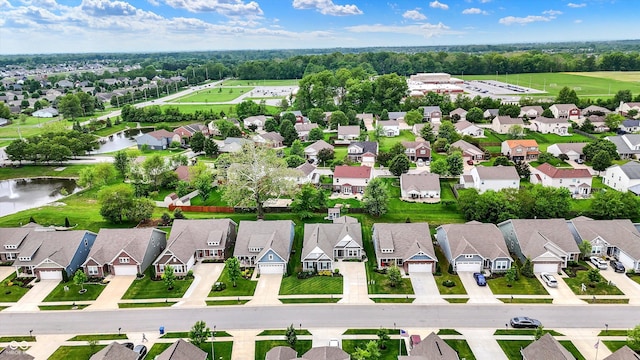 aerial view of residential area with a large body of water