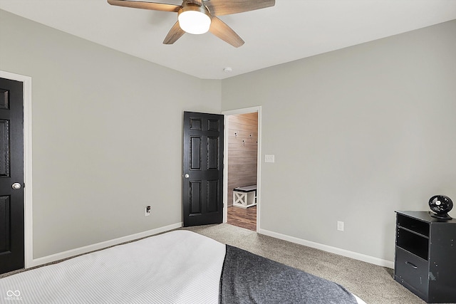 unfurnished bedroom with light carpet, baseboards, and ceiling fan