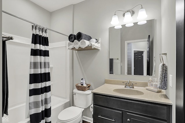 bathroom featuring shower / tub combo, vanity, and toilet