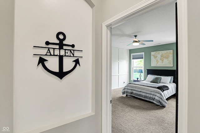 carpeted bedroom featuring a ceiling fan