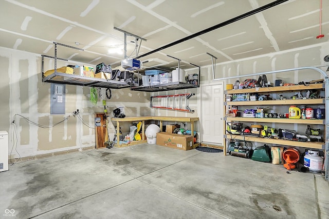 garage featuring a garage door opener and electric panel