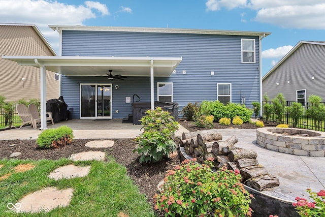 220 Sawdust Trl, Greenfield, IN 46140 - back of house with an outdoor fire pit, a hot tub, ceiling fan, and a patio area