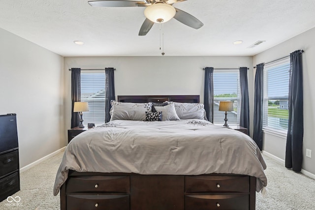 220 Sawdust Trl, Greenfield, IN 46140 - bedroom featuring light colored carpet, a ceiling fan, and a textured ceiling