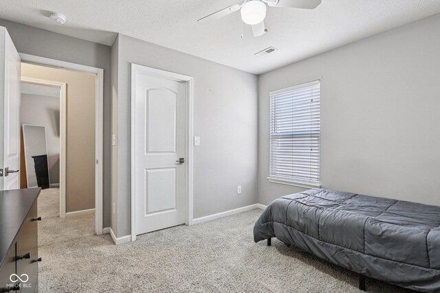 220 Sawdust Trl, Greenfield, IN 46140 - bedroom featuring light colored carpet and a ceiling fan