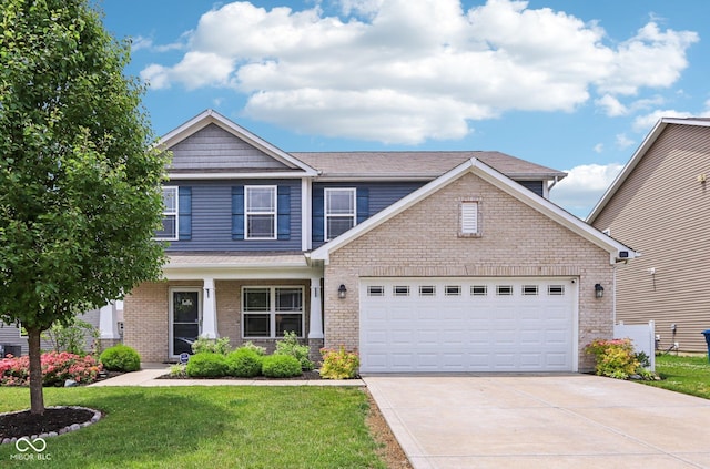 220 Sawdust Trl, Greenfield, IN 46140 - craftsman inspired home featuring concrete driveway, a front lawn, an attached garage, and brick siding