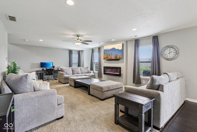 220 Sawdust Trl, Greenfield, IN 46140 - living area with a ceiling fan, a glass covered fireplace, and recessed lighting