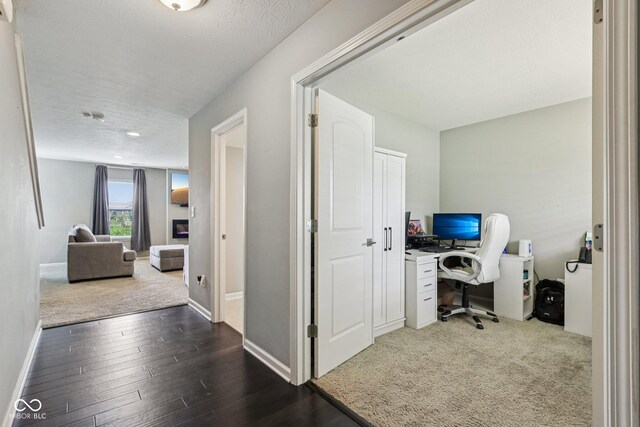 220 Sawdust Trl, Greenfield, IN 46140 - office area with dark wood-style flooring and a textured ceiling