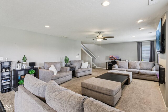 220 Sawdust Trl, Greenfield, IN 46140 - carpeted living room with stairs, ceiling fan, and recessed lighting