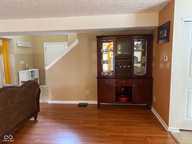 5241 Waterton Lakes Dr, Indianapolis, IN 46237 - interior space with wood finished floors, baseboards, and a textured ceiling