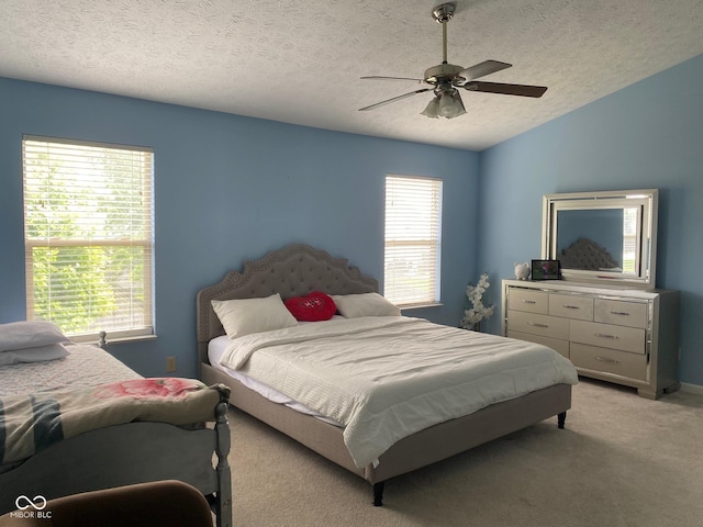 5241 Waterton Lakes Dr, Indianapolis, IN 46237 - bedroom with light colored carpet, a textured ceiling, lofted ceiling, and ceiling fan