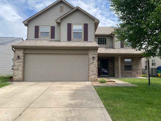 5241 Waterton Lakes Dr, Indianapolis, IN 46237 - traditional-style home with brick siding, an attached garage, concrete driveway, a front yard, and roof with shingles