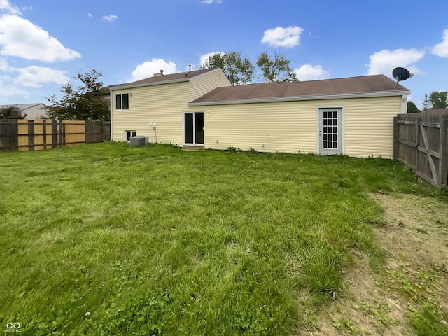 rear view of house with central air condition unit
