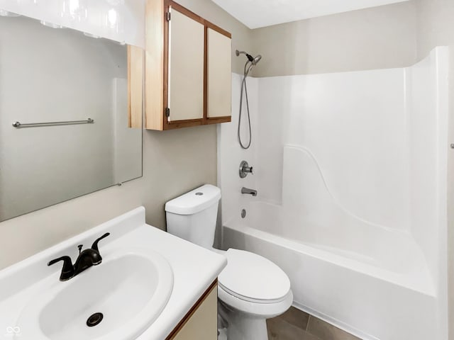 bathroom featuring toilet, vanity, shower / washtub combination, and tile patterned flooring