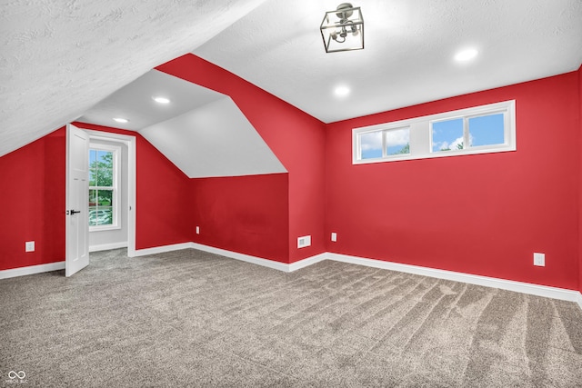 353 S Indiana St, Danville, IN 46122 - bonus room featuring a textured ceiling, baseboards, healthy amount of natural light, vaulted ceiling, and recessed lighting