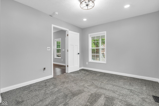 353 S Indiana St, Danville, IN 46122 - spare room featuring dark colored carpet, baseboards, a smoke detector, and recessed lighting