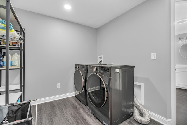 353 S Indiana St, Danville, IN 46122 - laundry room with wood finished floors, washer and clothes dryer, baseboards, and recessed lighting