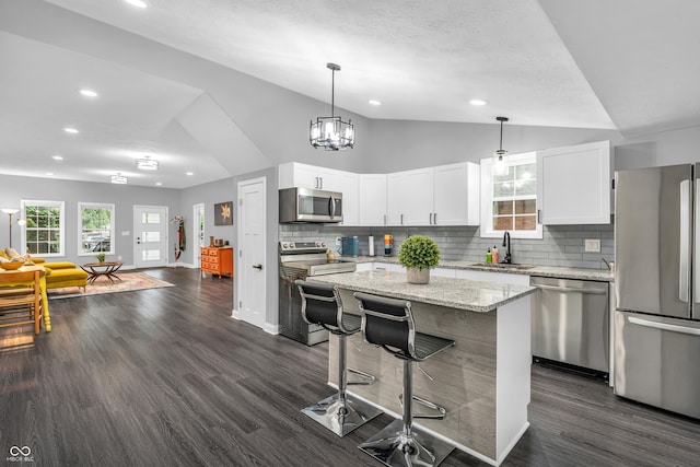 353 S Indiana St, Danville, IN 46122 - kitchen featuring appliances with stainless steel finishes, a sink, lofted ceiling, backsplash, and recessed lighting
